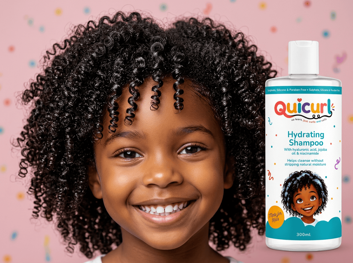 Smiling Quicurl kid with 4c coily pigtails